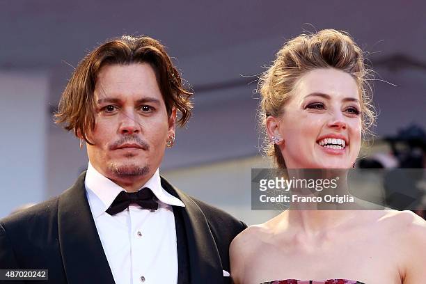 Johnny Depp and Amber Heard attend a premiere for 'A Danish Girl' during the 72nd Venice Film Festival at on September 5, 2015 in Venice, Italy.