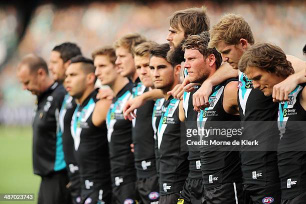 Power players line up before the round six AFL match between Port Adelaide Power and the Geelong Cats at Adelaide Oval on April 27, 2014 in Adelaide,...
