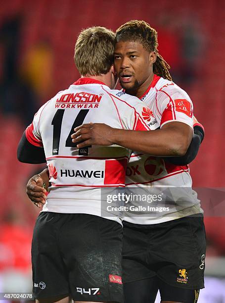 Howard Mnisi of Lions and Ruan Combrinck of Lions celebrate the bonus point try during the Absa Currie Cup match between Xerox Golden Lions and EP...