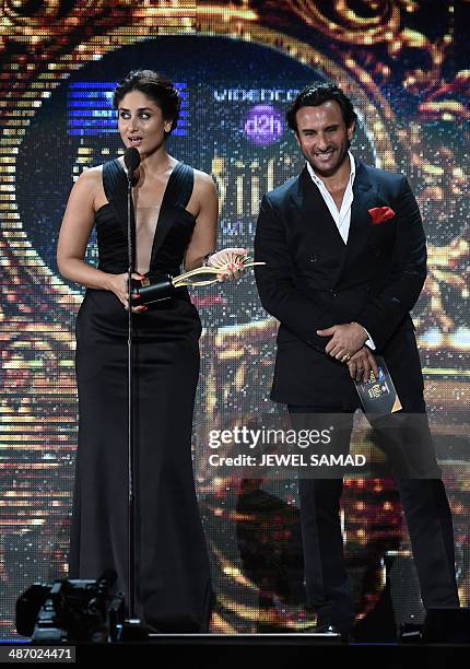 Bollywood actress Kareena Kapoor and Bollywood actor Saif Ali Khan present the award for Best Playback Male Singer on stage at the Raymond James...