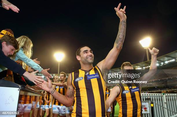 Shaun Burgoyne and Sam Mitchell of the Hawks wave to the crowd as they leave the field in their 250th games during the round six AFL match between...