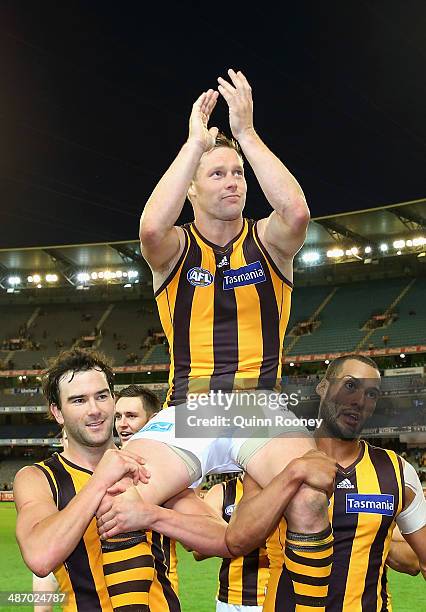 Sam Mitchell of the Hawks is chaired off the field in his 250th games during the round six AFL match between the Richmond Tiges and the Hawthorn...