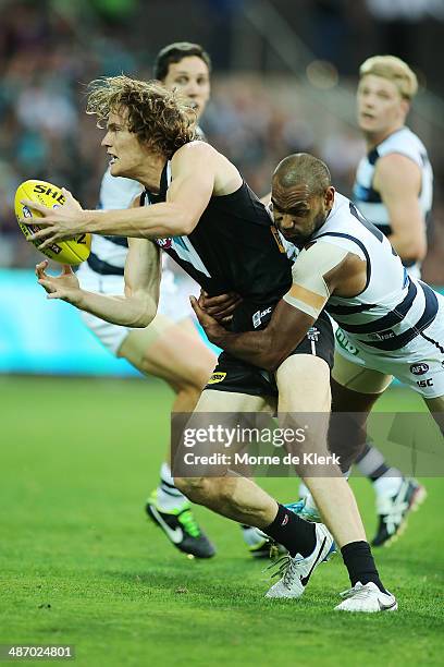 Jared Polec of the Power is tackled during the round six AFL match between Port Adelaide Power and the Geelong Cats at Adelaide Oval on April 27,...