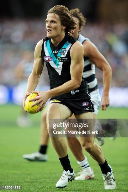 Jared Polec of the Power runs with the ball during the round six AFL match between Port Adelaide Power and the Geelong Cats at Adelaide Oval on April...