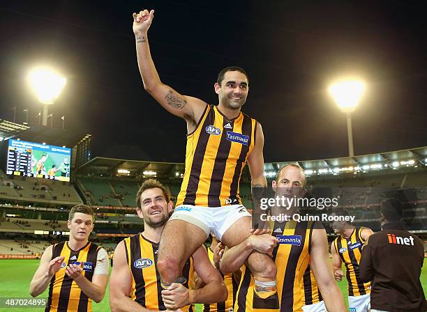 Shaun Burgoyne of the Hawks is chaired off the field in his 250th games during the round six AFL match between the Richmond Tiges and the Hawthorn...