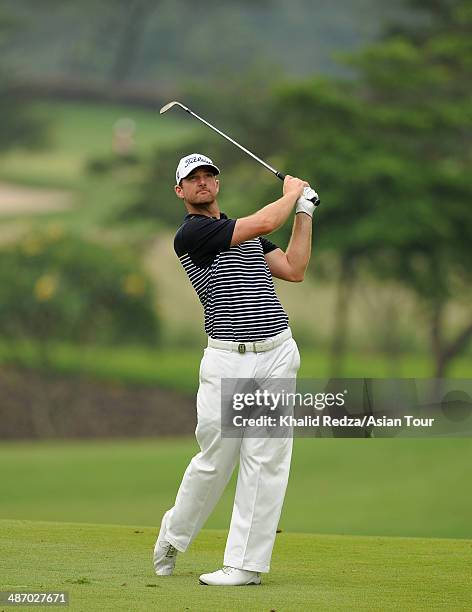 Marcus Both of Australia plays a shot during round four of the CIMB Niaga Indonesian Masters at Royale Jakarta Golf Club on April 27, 2014 in...