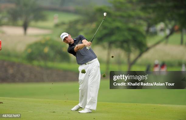 Marcus Both of Australia plays a shot during round four of the CIMB Niaga Indonesian Masters at Royale Jakarta Golf Club on April 27, 2014 in...