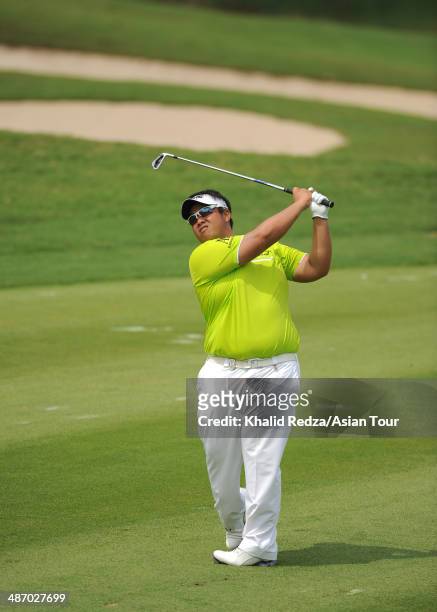 Kiradech Aphibrnrat of Thailand in action during round four of the CIMB Niaga Indonesian Masters at Royale Jakarta Golf Club on April 27, 2014 in...