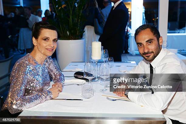 Actress Juliette Binoche and director Piero Messina attend a cocktail reception for 'The Wait' hosted by Tiffany & Co. During the 72nd Venice Film...