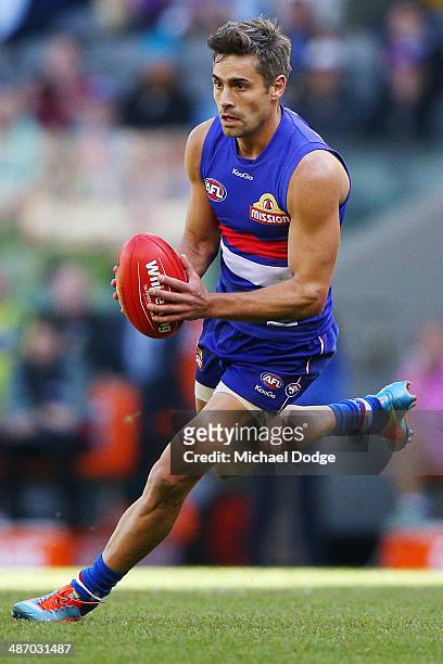 Daniel Giansiracusa of the Bulldogs runs with the ball during the round six AFL match between the Western Bulldogs and the Adelaide Crows at Etihad...
