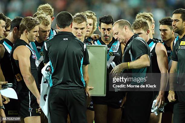 Ken Hinkley of the Power speaks to his team at three-quarter time during the round six AFL match between Port Adelaide Power and the Geelong Cats at...