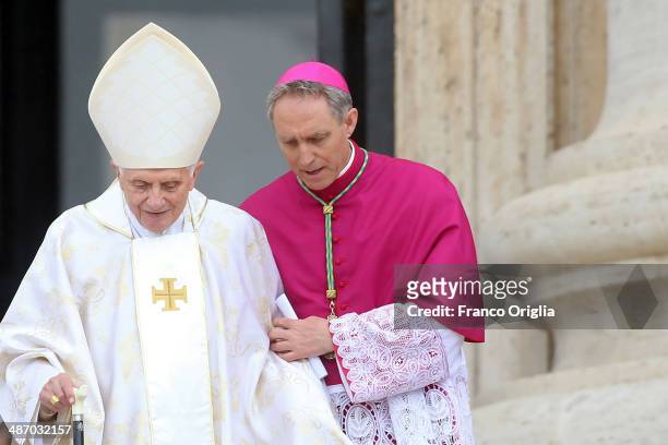 Pope Emeritus Benedict XVI, flanked by Prefect of the Pontifical House and his former personal secretary Georg Ganswein arrives at the Canonisation...