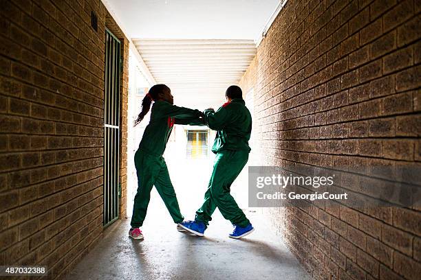 school kids fighting - teen fight stock pictures, royalty-free photos & images