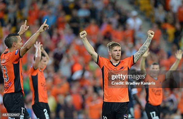 Luke Brattan of the Roar and team mates celebrate victory after the A-League Semi Final match between the Brisbane Roar and Melbourne Victory at...