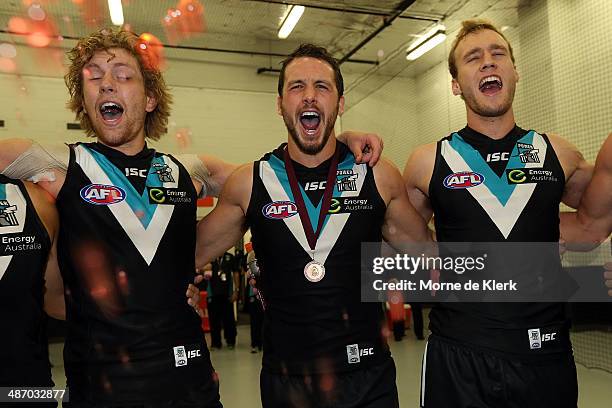 Power players celebrate after the round six AFL match between Port Adelaide Power and the Geelong Cats at Adelaide Oval on April 27, 2014 in...