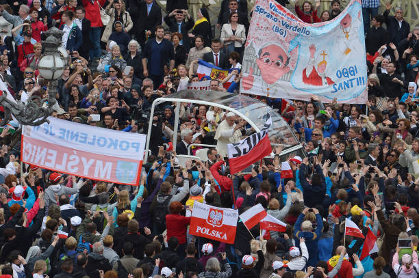 Pope Francis greets the crowd from his popemobile after the canonisation mass of Popes John XXIII and John Paul II on St Peter's at the Vatican on...