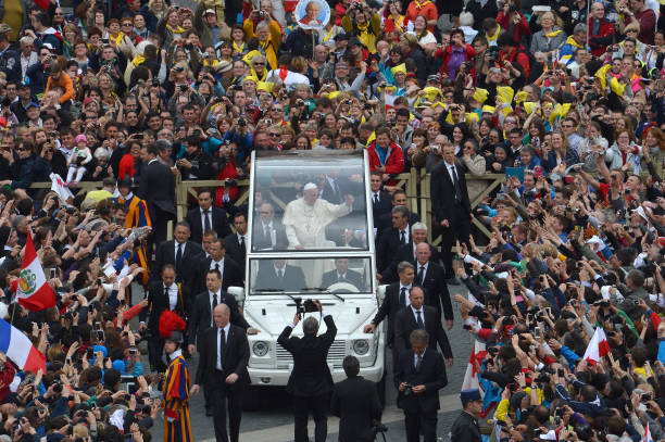 Pope Francis greets the crowd from his popemobile after the canonisation mass of Popes John XXIII and John Paul II on St Peter's at the Vatican on...