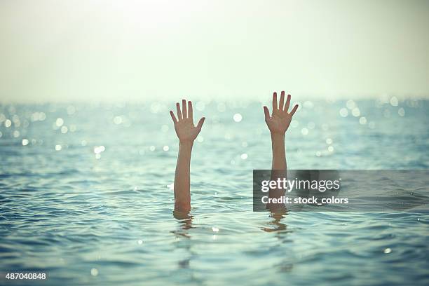 waving for help - sos stock pictures, royalty-free photos & images