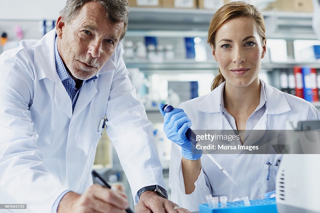 Scientists working together in laboratory