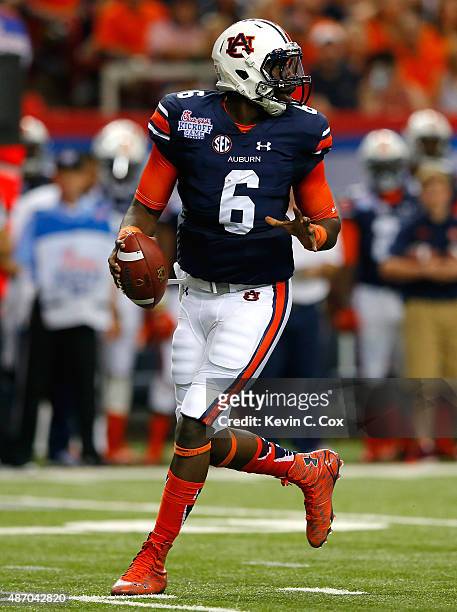Jeremy Johnson of the Auburn Tigers steps back to pass against the Louisville Cardinals at Georgia Dome on September 5, 2015 in Atlanta, Georgia.