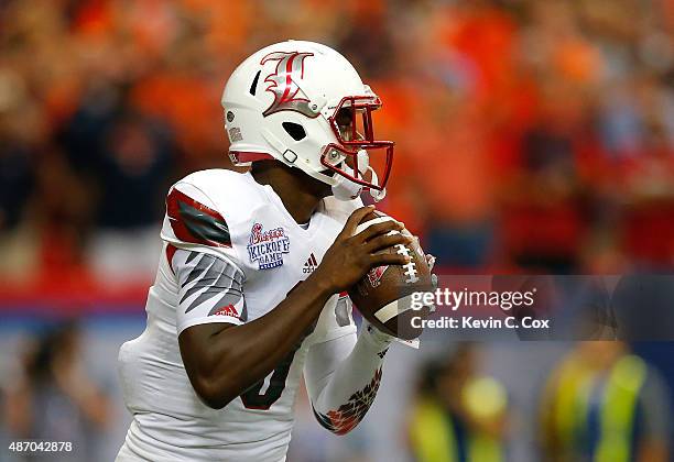 Lamar Jackson of the Louisville Cardinals looks to pass against the Auburn Tigers at Georgia Dome on September 5, 2015 in Atlanta, Georgia.