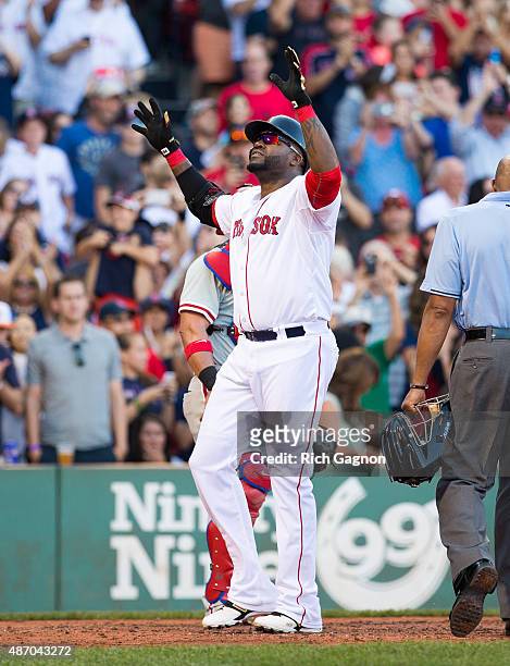 David Ortiz of the Boston Red Sox celebrates his 496th career home run during the fourth inning against the Philadelphia Phillies at Fenway Park on...