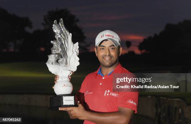 Anirban Lahiri celebrates with the trophy after winning of the CIMB Niaga Indonesian Masters at Royale Jakarta Golf Club on April 27, 2014 in...