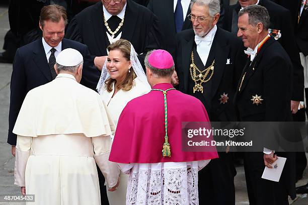 Pope Francis greets Grand Duchess Maria Teresa of Luxembourg and Henri, Grand Duke of Luxembourg after the canonisation in which John Paul II and...