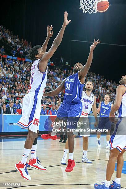 Jamar Wilson of Finland goes up to the basket against Mickael Gelabale of France during the EuroBasket Group Phase game between France v Finland at...