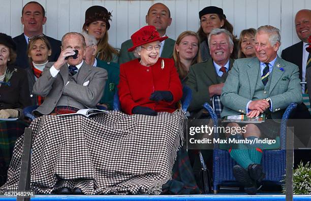 Prince Philip, Duke of Edinburgh, Queen Elizabeth II and Prince Charles, Prince of Wales attend the Braemar Gathering at The Princess Royal and Duke...