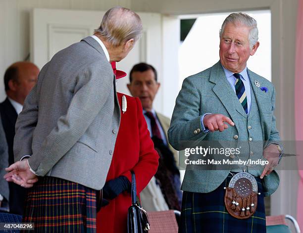 Prince Philip, Duke of Edinburgh and Prince Charles, Prince of Wales attend the Braemar Gathering at The Princess Royal and Duke of Fife Memorial...