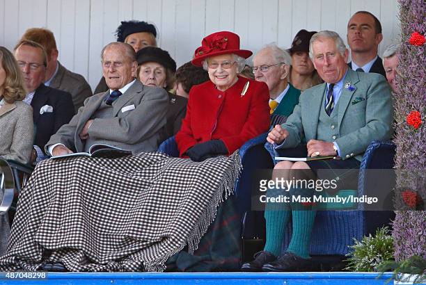 Prince Philip, Duke of Edinburgh, Queen Elizabeth II and Prince Charles, Prince of Wales attend the Braemar Gathering at The Princess Royal and Duke...