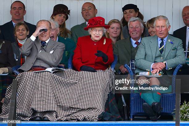 Prince Philip, Duke of Edinburgh, Queen Elizabeth II and Prince Charles, Prince of Wales attend the Braemar Gathering at The Princess Royal and Duke...