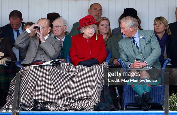 Prince Philip, Duke of Edinburgh, Queen Elizabeth II and Prince Charles, Prince of Wales attend the Braemar Gathering at The Princess Royal and Duke...