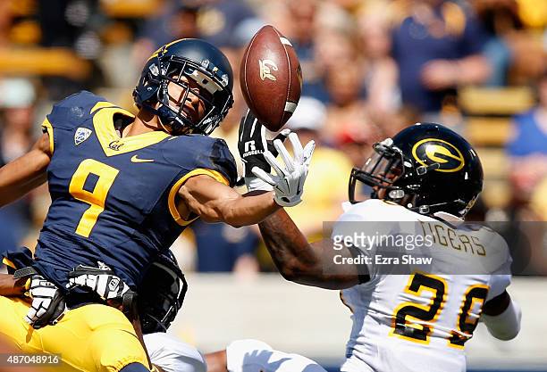 Trevor Davis of the California Golden Bears can not hold on to the ball while covered by Guy Stallworth of the Grambling State Tigers at California...