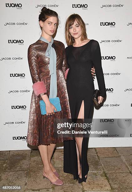 Guest and Dakota Johnson attends the 'Being The Protagonist' Party hosted By L'Uomo Vogue during the 72nd Venice Film Festival at San Clemente Palace...