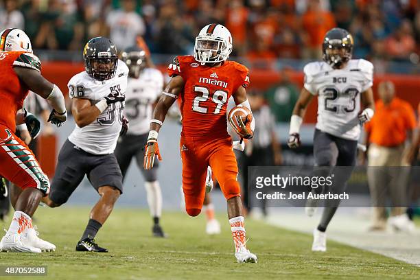 Corn Elder of the Miami Hurricanes runs the punt back against the Bethune-Cookman Wildcats on September 5, 2015 at Sun Life Stadium in Miami Gardens,...