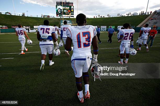 Edward Goubadia and the Savannah State Tigers leave the field after being defeated 65-13 by the Colorado State Rams at Sonny Lubick Field at Hughes...