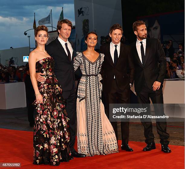 Actress Amber Heard, director Tom Hooper, actors Alicia Vikander, Eddie Redmayne and Matthias Schoenaerts attend a premiere for 'A Danish Girl'...