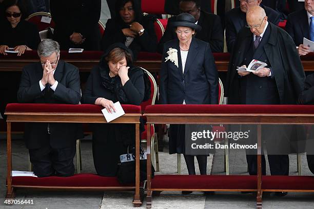 Italian President Giorgio Napolitano and his wife Clio take their seats next to Polish President Bronislaw Komorowski and his wife Anna Komorowska...