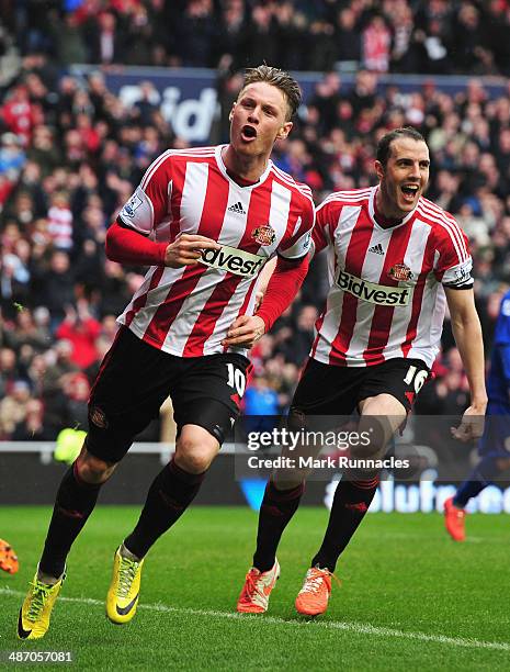 Connor Wickham of Sunderland celebrates scoring his second goal with John O'Shea of Sunderland during the Barclays Premier League match between...