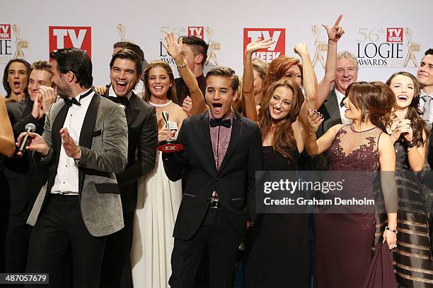 The cast of Home and Away pose in the awards room after winning a Logie for Most Popular Drama Program at the 2014 Logie Awards at Crown Palladium on...