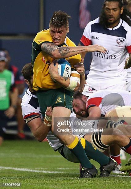 Sean McMahon of the Australia Wallabies is tackled against the United States Eagles during a match at Soldier Field on September 5, 2015 in Chicago,...