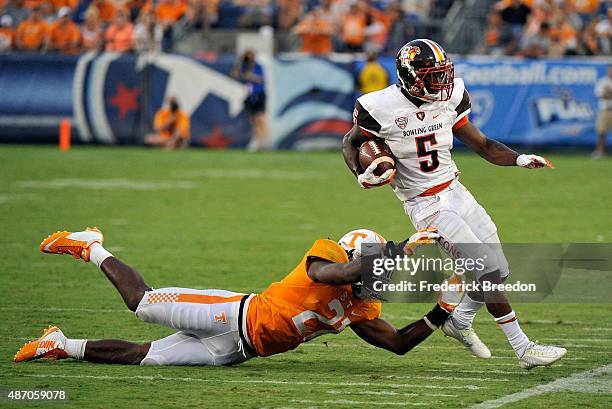 Jalen Reeves-Maybin of the University of Tennessee Volunteers forces Ronnie Moore of the Bowling Green Falcons out of bounds during the second half...