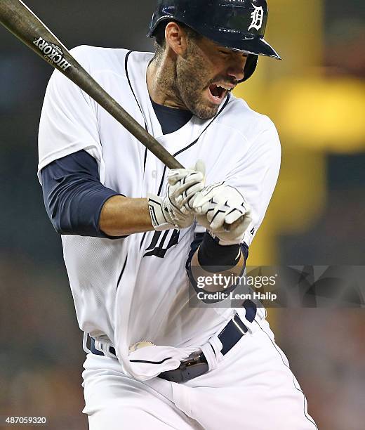 Martinez of the Detroit Tigers reacts after getting hit by a pitch during the seventh inning of the game against the Cleveland Indians on September...