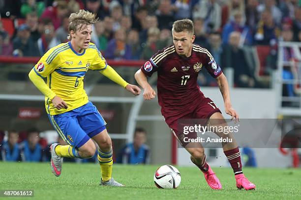 Oleg Shatov of Russia vies with Emil Forsberg of Sweden during the UEFA Euro 2016 qualifying round Group G football match at Otkritie stadium in...