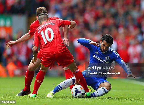 Philippe Coutinho of Liverpool tackles Mohamed Salah of Chelsea during the Barclays Premier League match between Liverpool and Chelsea at Anfield on...