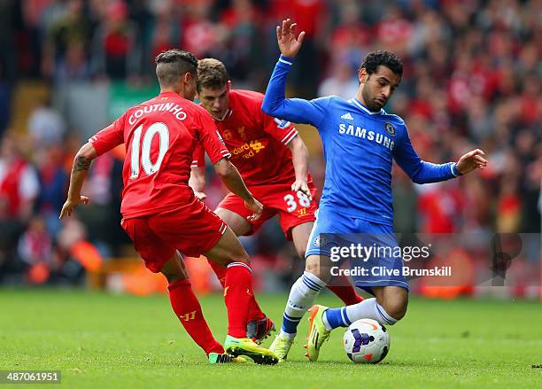 Philippe Coutinho of Liverpool tackles Mohamed Salah of Chelsea during the Barclays Premier League match between Liverpool and Chelsea at Anfield on...