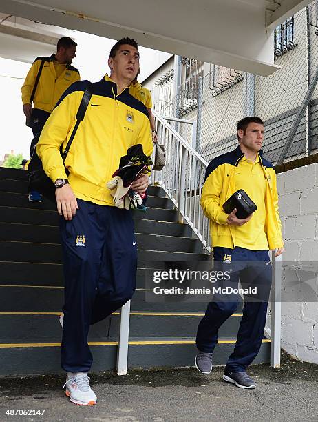 James Milner and Costel Pantilimon of Manchester City arrive for the Barclays Premier League match between Crystal Palace and Manchester City at...