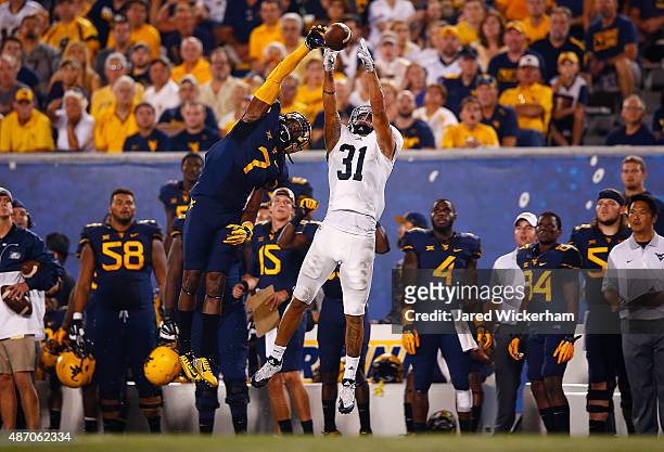 Daryl Worley of the West Virginia Mountaineers breaks up a pass intended for Ryan Longoria of the Georgia Southern Eagles in the first half during...